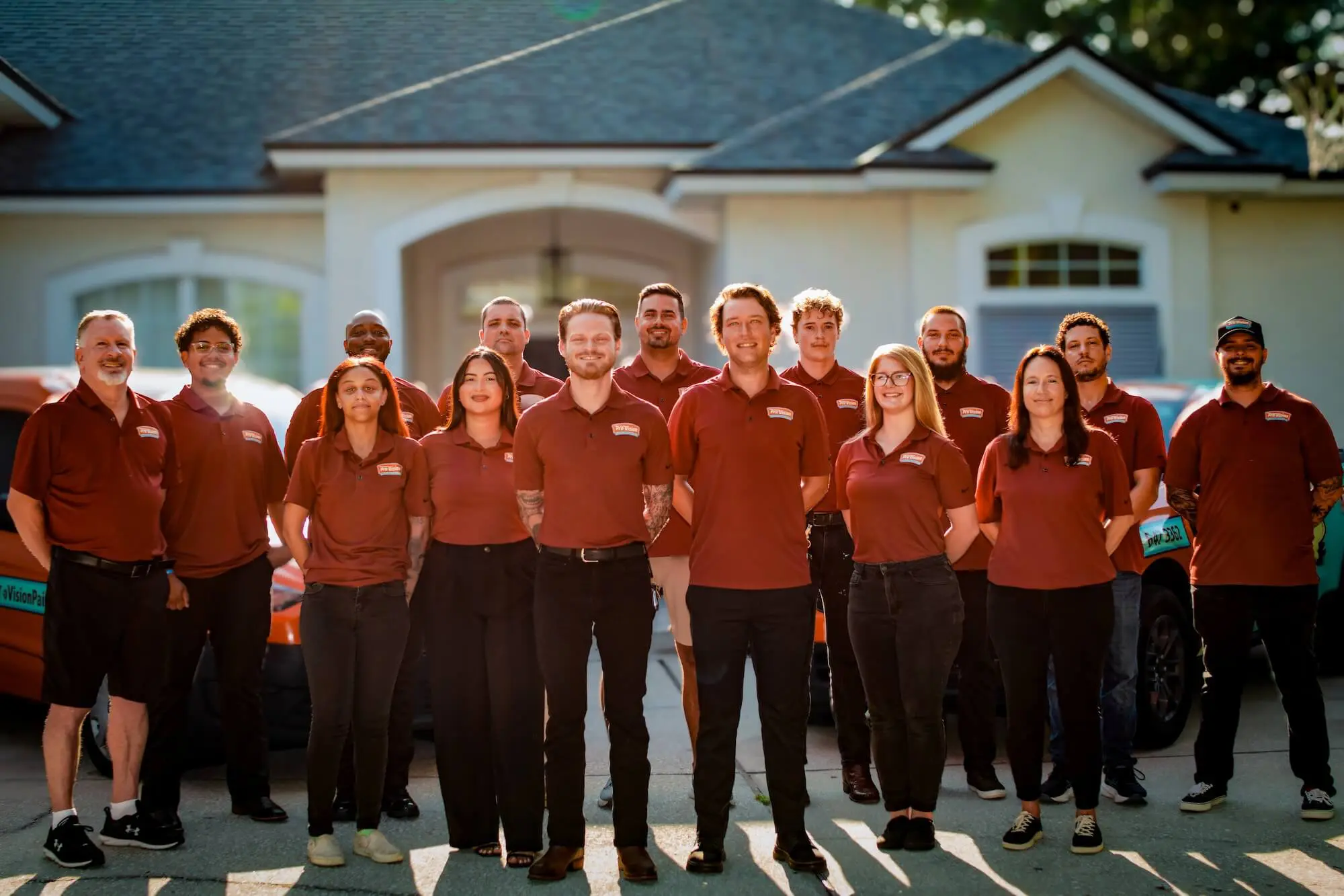 pro-vision painting team standing in front of jacksonville home after painting