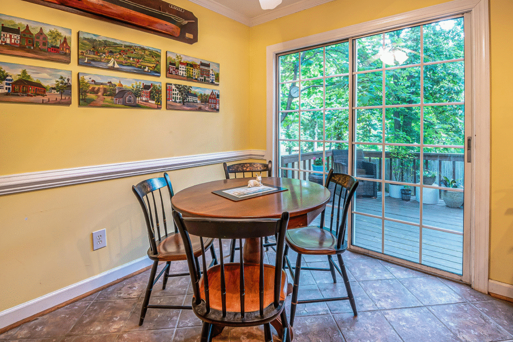 cozy dining area overlooks a deck, emphasizing outdoor wood protection Florida. The deck is ready for family gatherings.