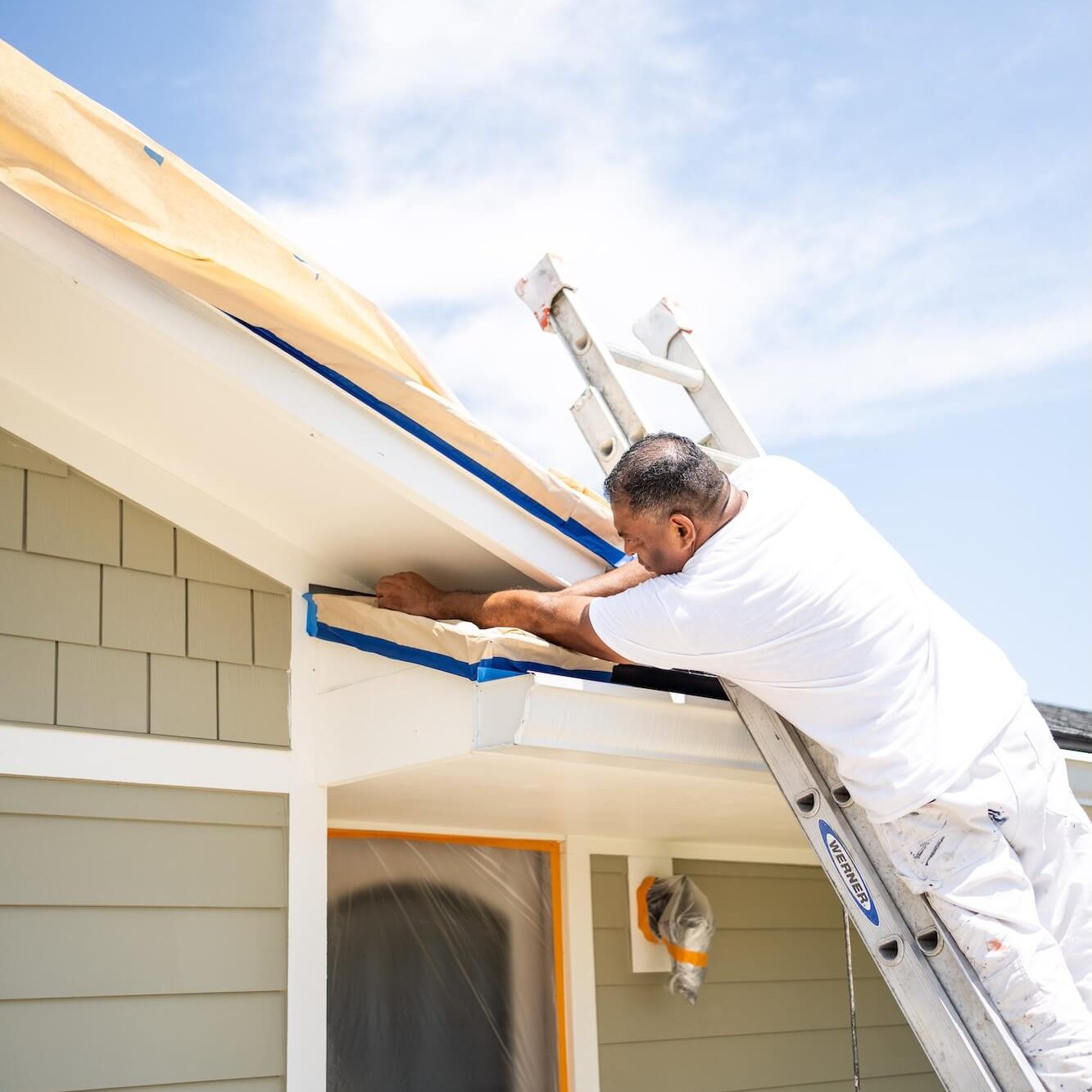 Pro-Vision Painting team outside a Jacksonville Beach home